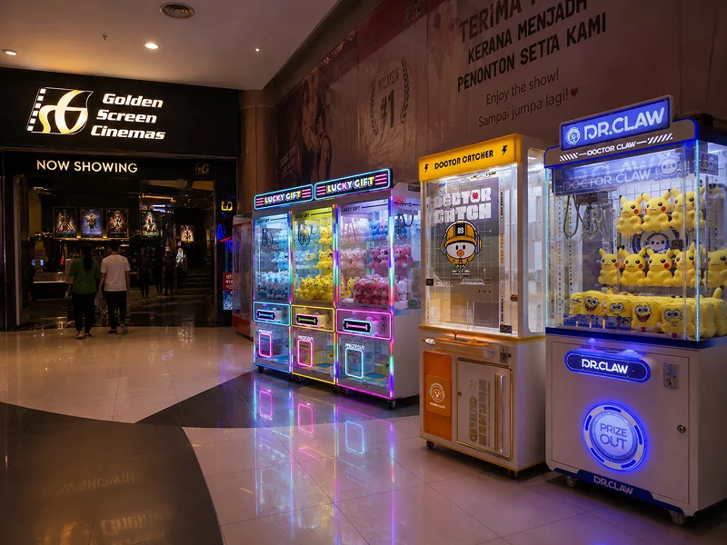 Claw machines in a cinema lobby